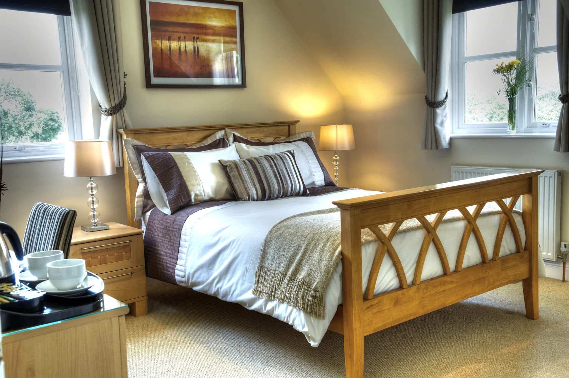A bed in a room with a window.